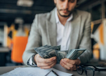 Disciplined trading mindset, technical analysis gold prices. Man counting the money, Math in forex.